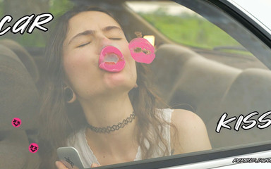 Messy Pink Lipgloss Marks on the Car Window