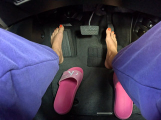 Girl Driving Car Barefoot and Pressing the Pedal